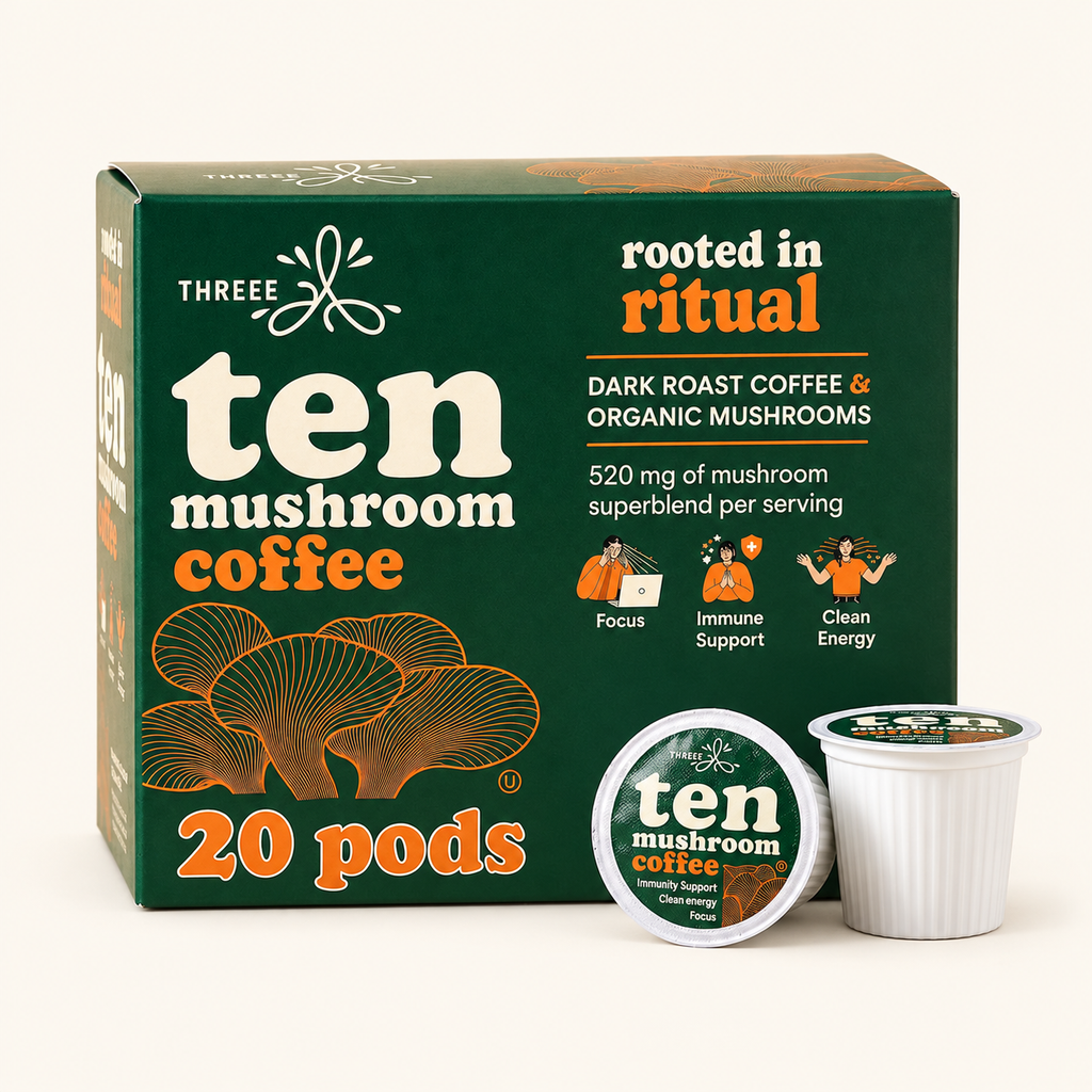 THREEE Ten Mushroom Coffee 20-count dark roast pod box with two coffee pods on a light cream background